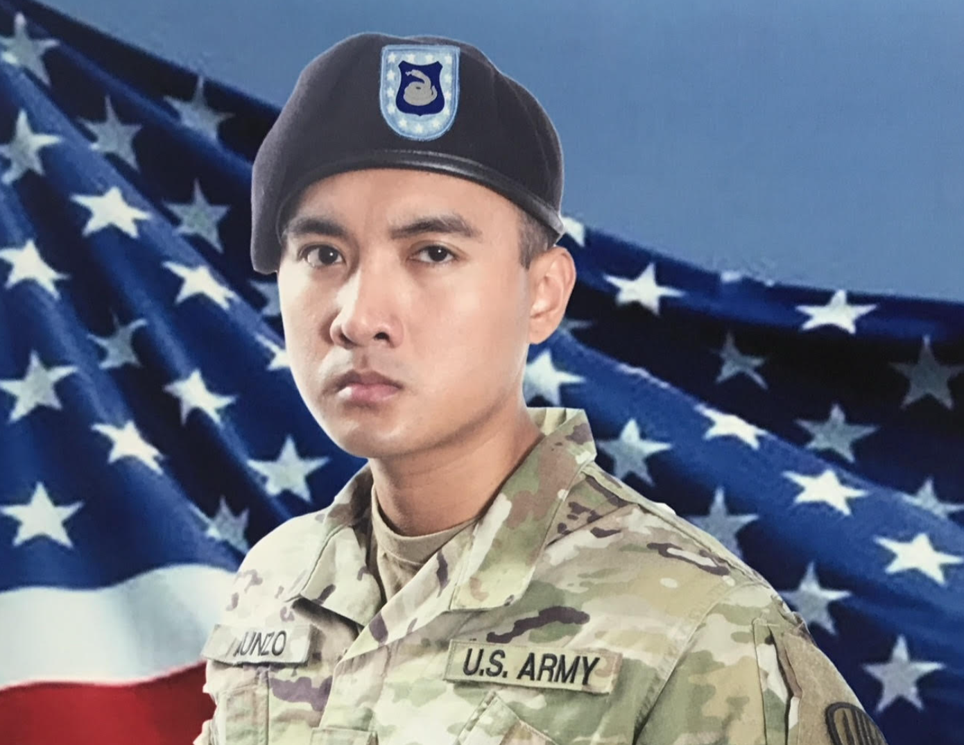 Wilann Keith Aunzo in U.S. Army uniform with American flag